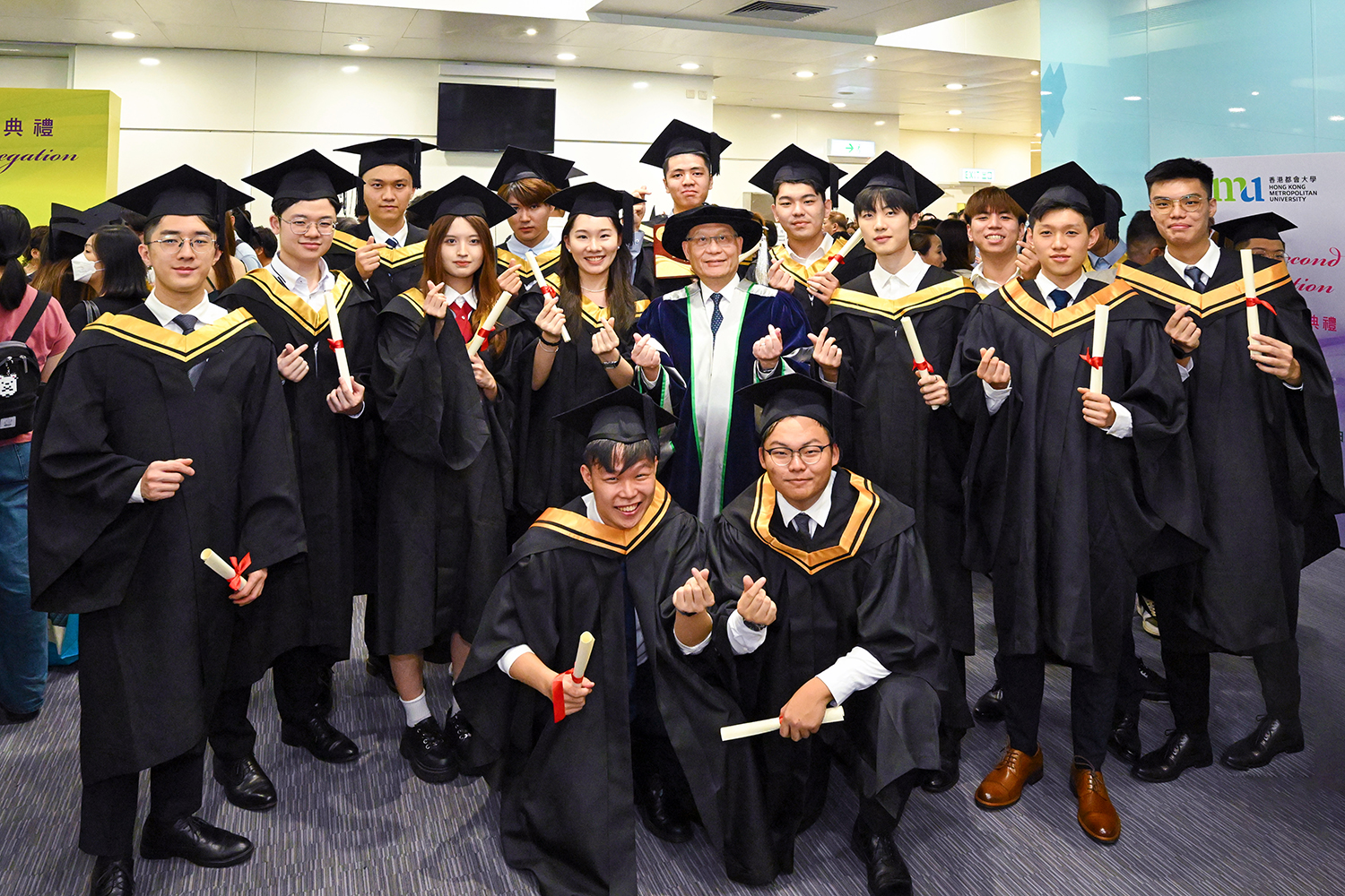 HKMU President Prof. Lam Kwan-sing congratulates the graduates for successfully completing their studies and bonds with them.