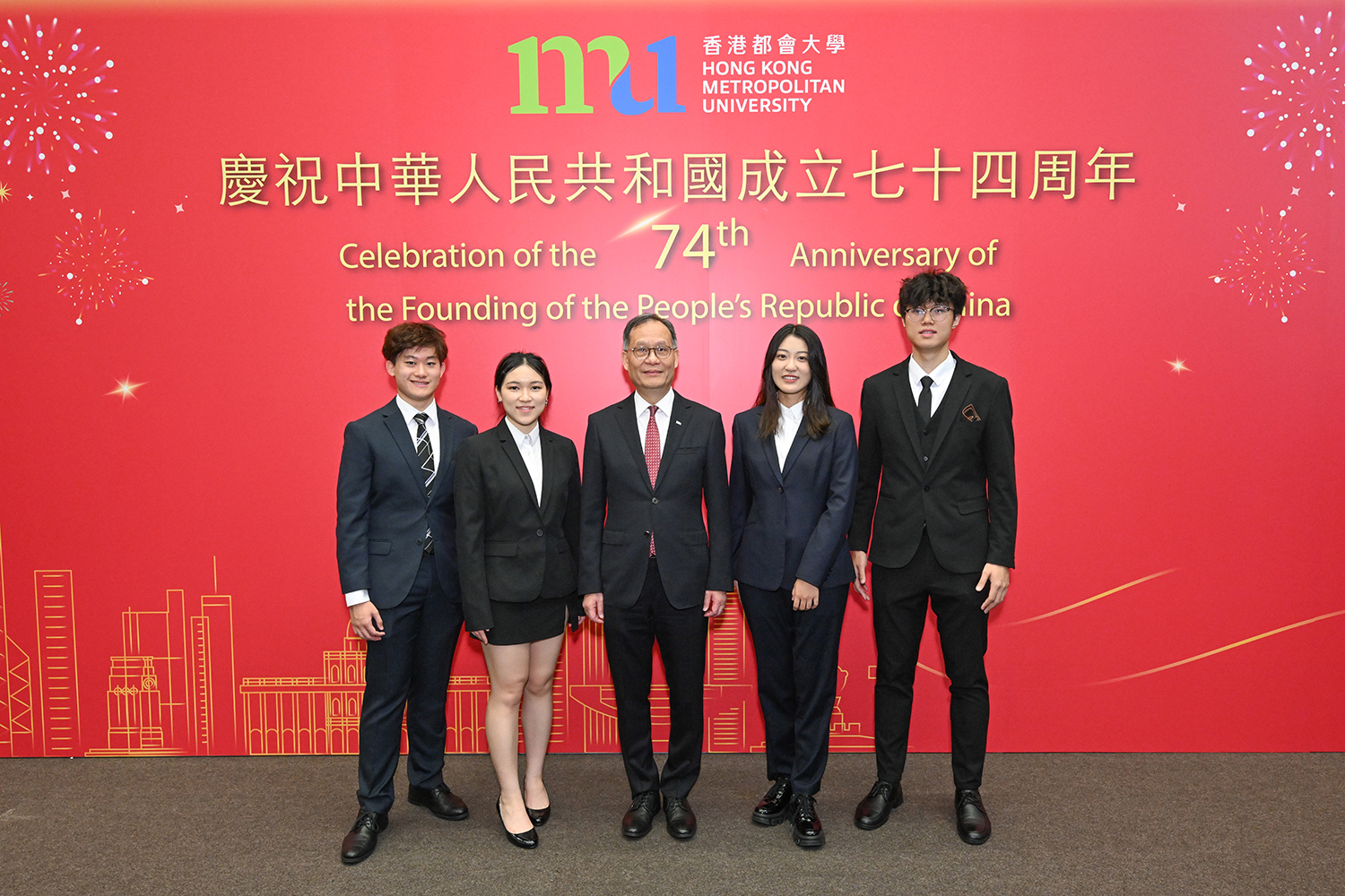 HKMU students express their excitement about participating in the National Day flag-raising ceremony. HKMU President Prof. Paul Lam Kwan-sing (middle) poses with (from left) local students Marcelino Cheung Ho-chai and Lai Yan-yu and mainland students Xie Ruoshui and Qiu Yancong at the ceremony.